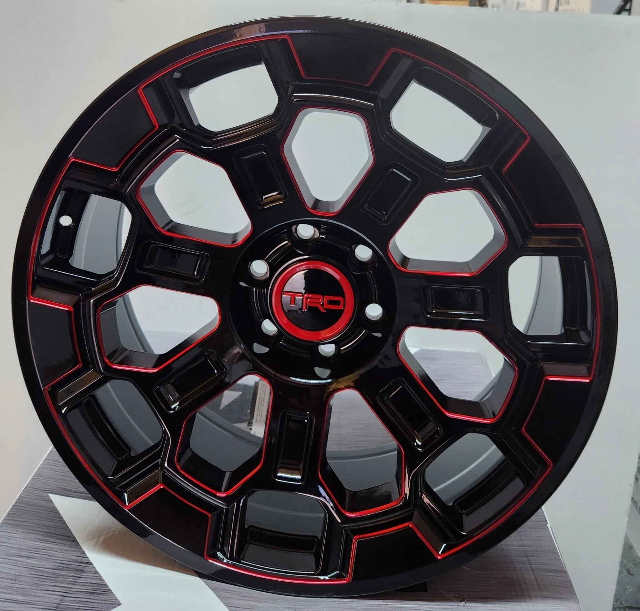 2022 TRD OFF-ROAD 22x9.0 6x139.7 GLOSS BLACK WITH RED MILLiNG FACE